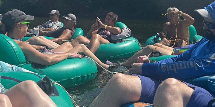 Group Of People On Tubes